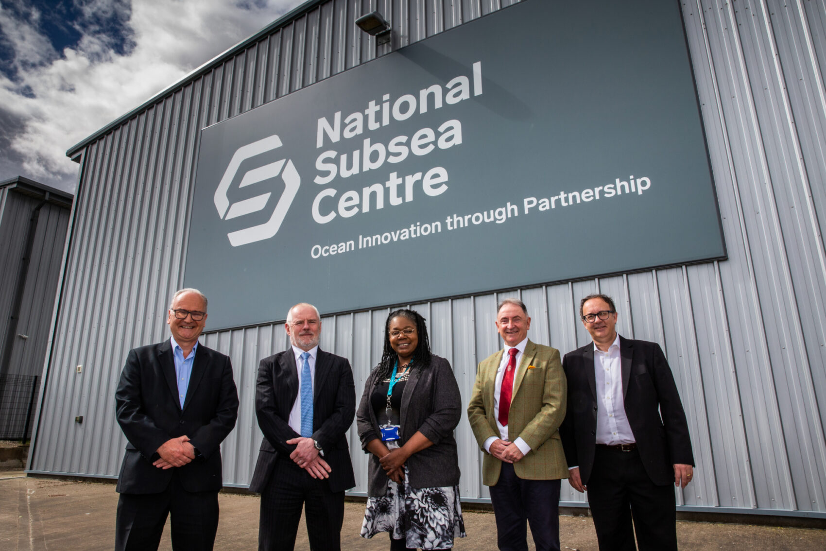 Team Members of NSC Stand Outside NSC Building