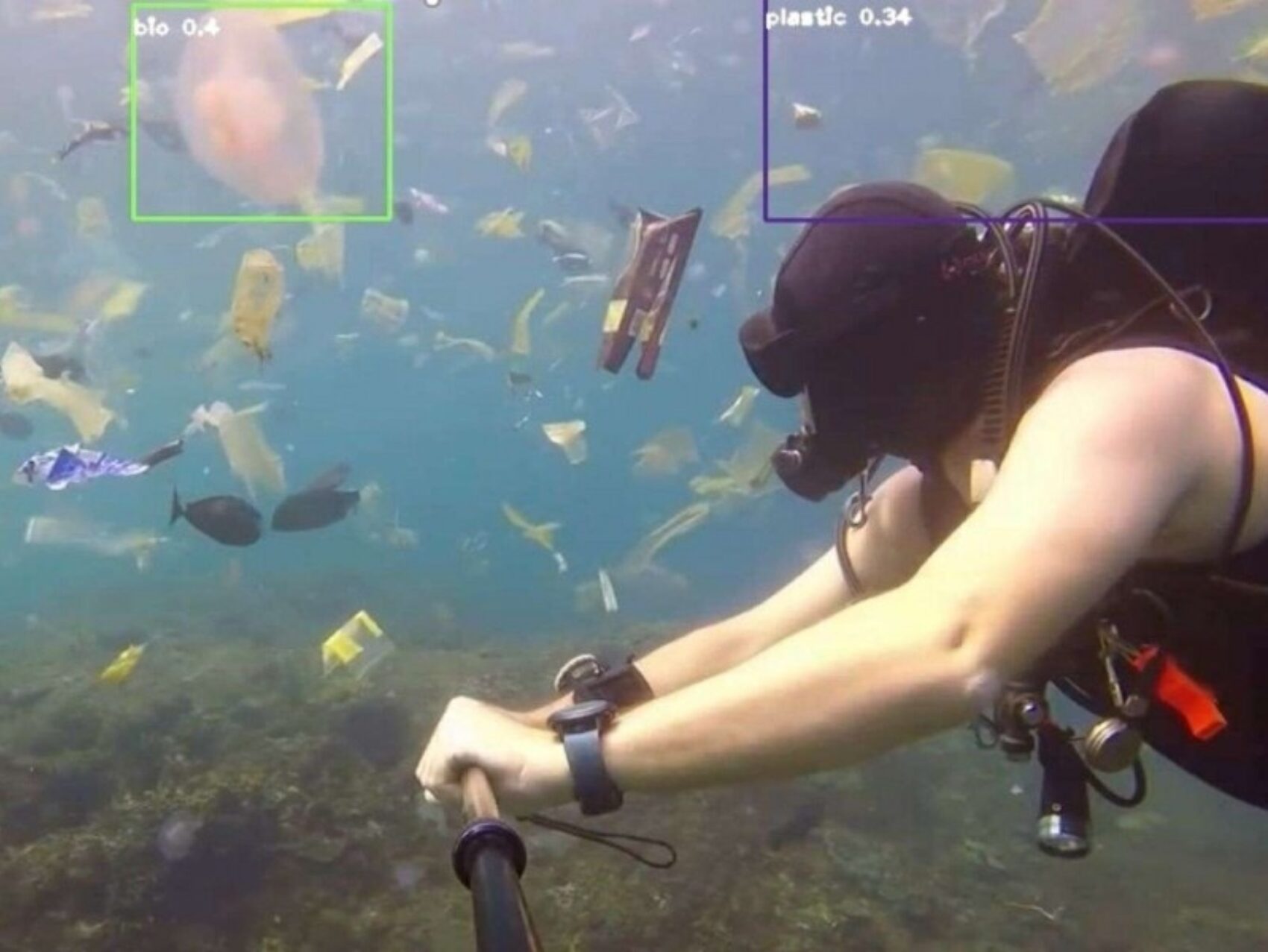 Scuba Diver Swimming Amongst Ocean Polution